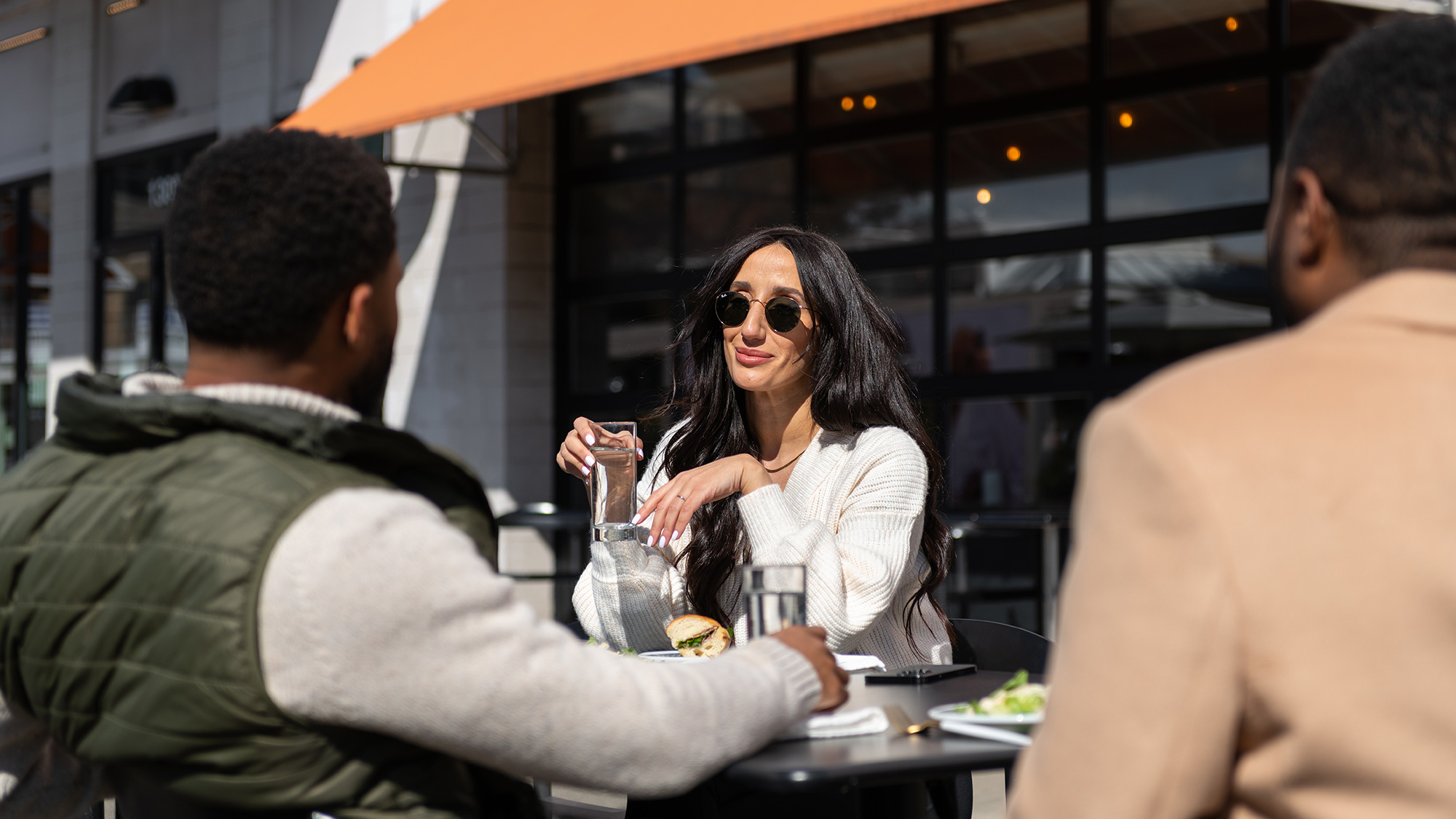 A group of friends eating outside together at Union Market
