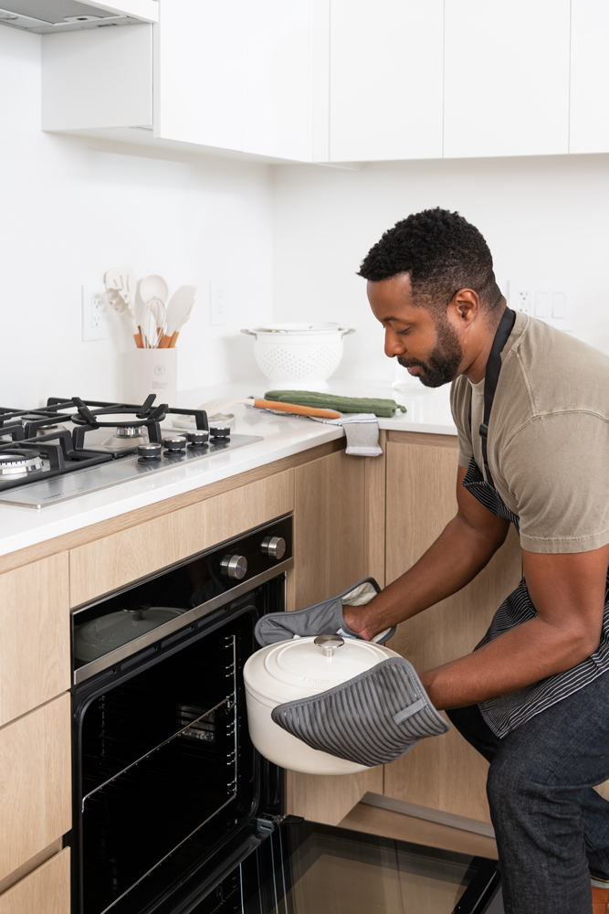 Tenants cooking with their latest built-in kitchen appliances